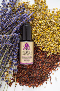 face serum bottle with herbs